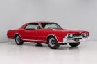 1967 Oldsmobile 442 Rally Red accented by excellent chrome