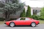 1975 Ferrari 308GT4 Gasoline Red with a tan leather interior